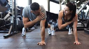 Toning Bingo Wings: Your Ultimate Guide to Sculpting Sleek Arms at the Gym 3 Fitness trainer demonstrating arm toning exercises Southall